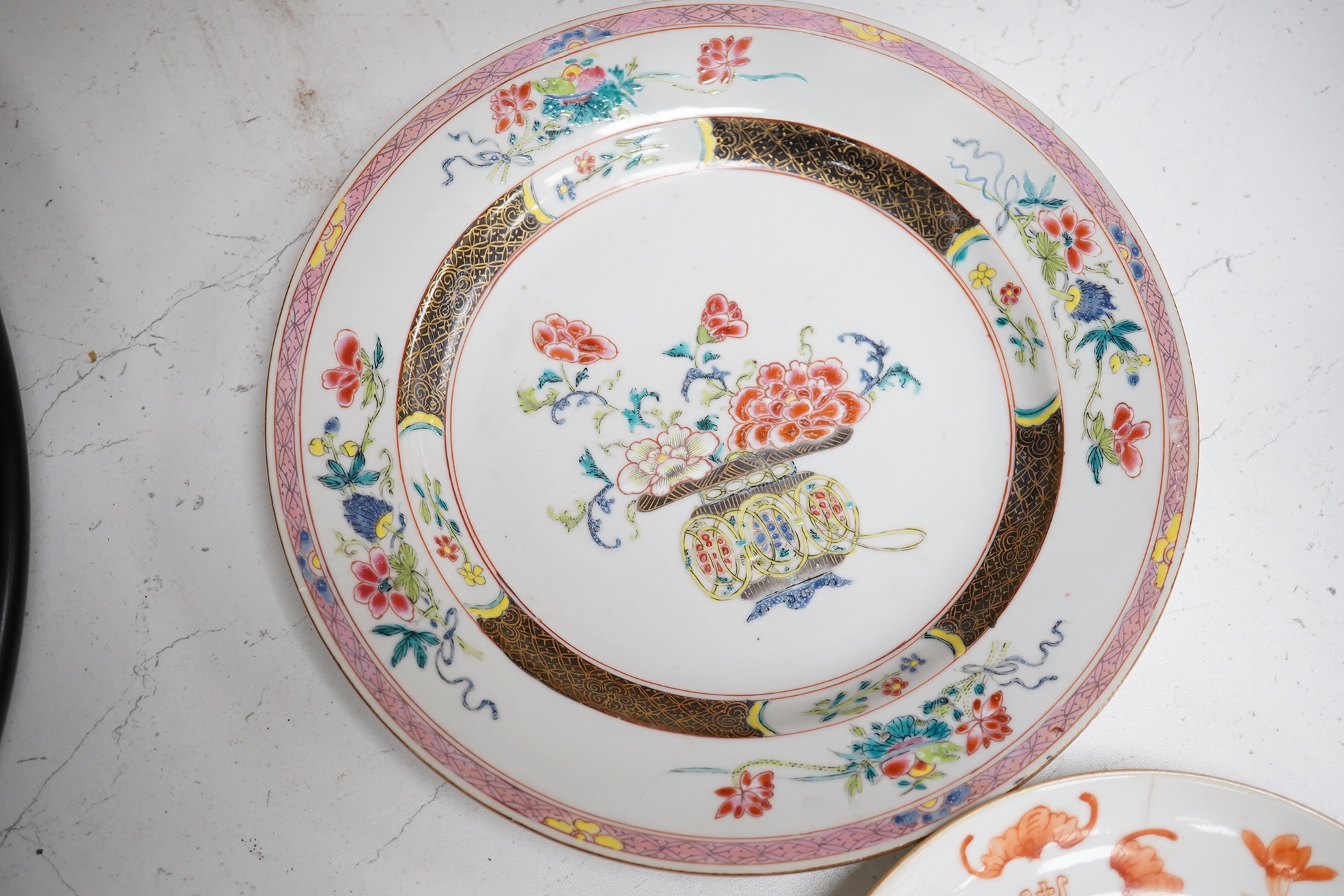 A Chinese iron-red ‘sanduo’ dish, 19th century and a Chinese famille rose plate, Yongzheng. famille rose plate 22.5cm diameter. Condition - poor to fair